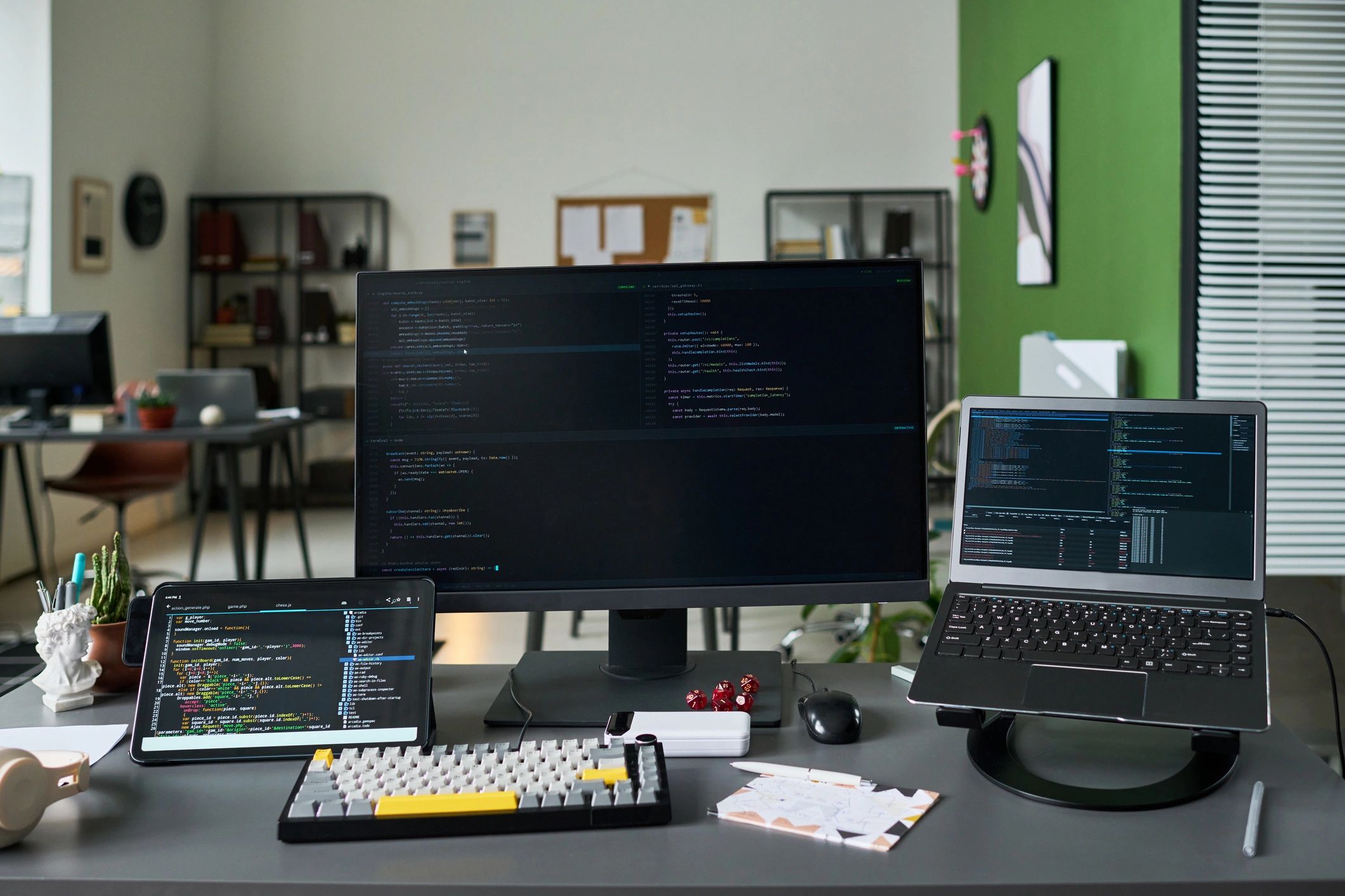 Cybersecurity workspace with laptop and monitor
